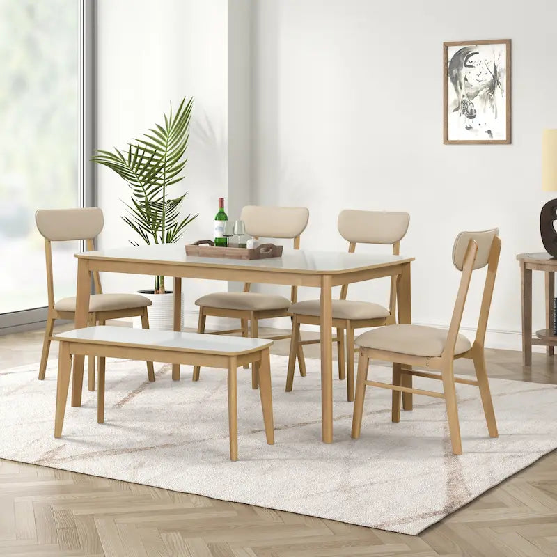 Ensemble de salle à manger rectangulaire 6 pièces avec 4 chaises rembourrées et un banc. Style moderne et décontracté.