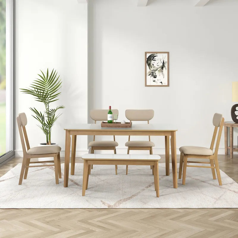 Ensemble de salle à manger rectangulaire 6 pièces avec 4 chaises rembourrées et un banc. Style moderne et décontracté.