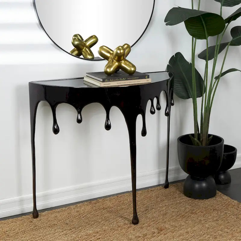 Table basse ou console décorative en aluminium effet goutte d'eau, pieds design effet fondu et plateau en verre teinté - Roche River Decor
