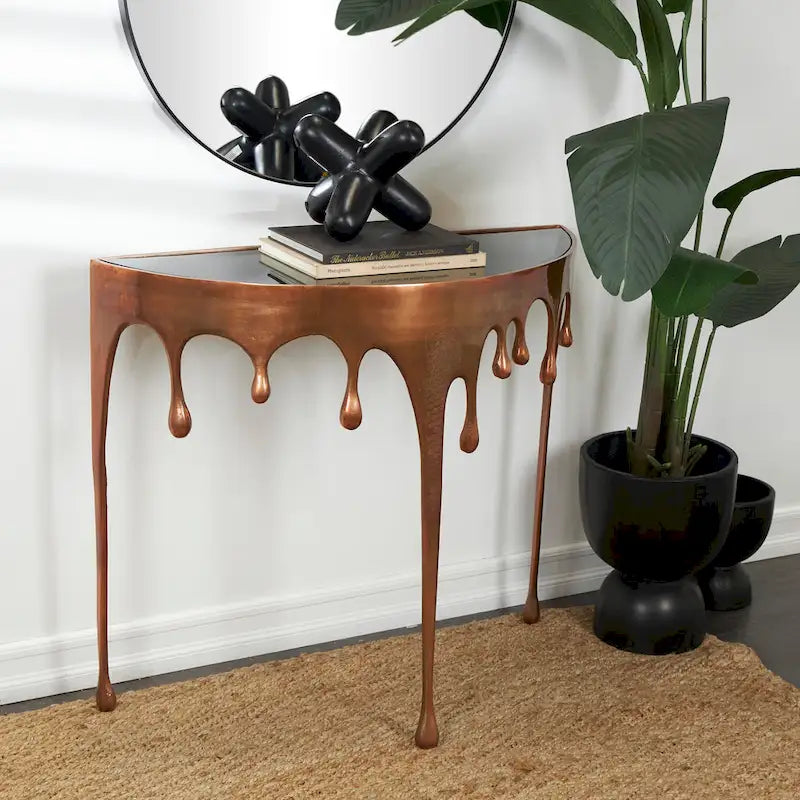 Table basse ou console décorative en aluminium effet goutte d'eau, pieds design effet fondu et plateau en verre teinté - Roche River Decor