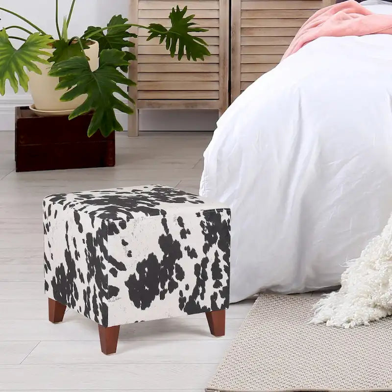 Pouf cube style britannique Adeco à motif vache, repose-pieds élégant
