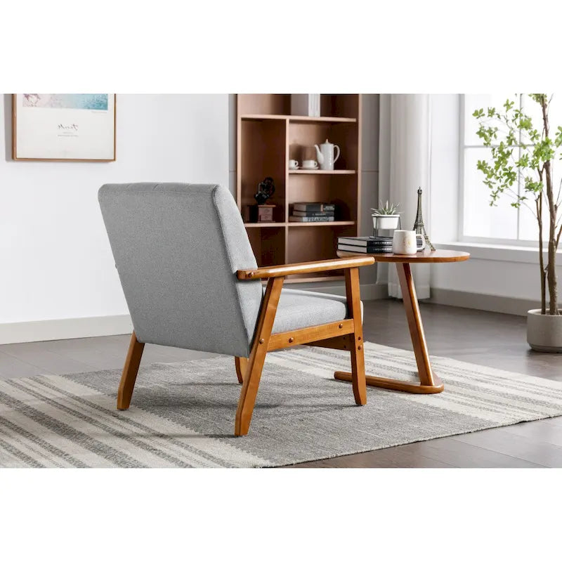 Fauteuil de détente avec accoudoirs et pieds en bois massif, idéal pour le salon, la chambre ou un studio.